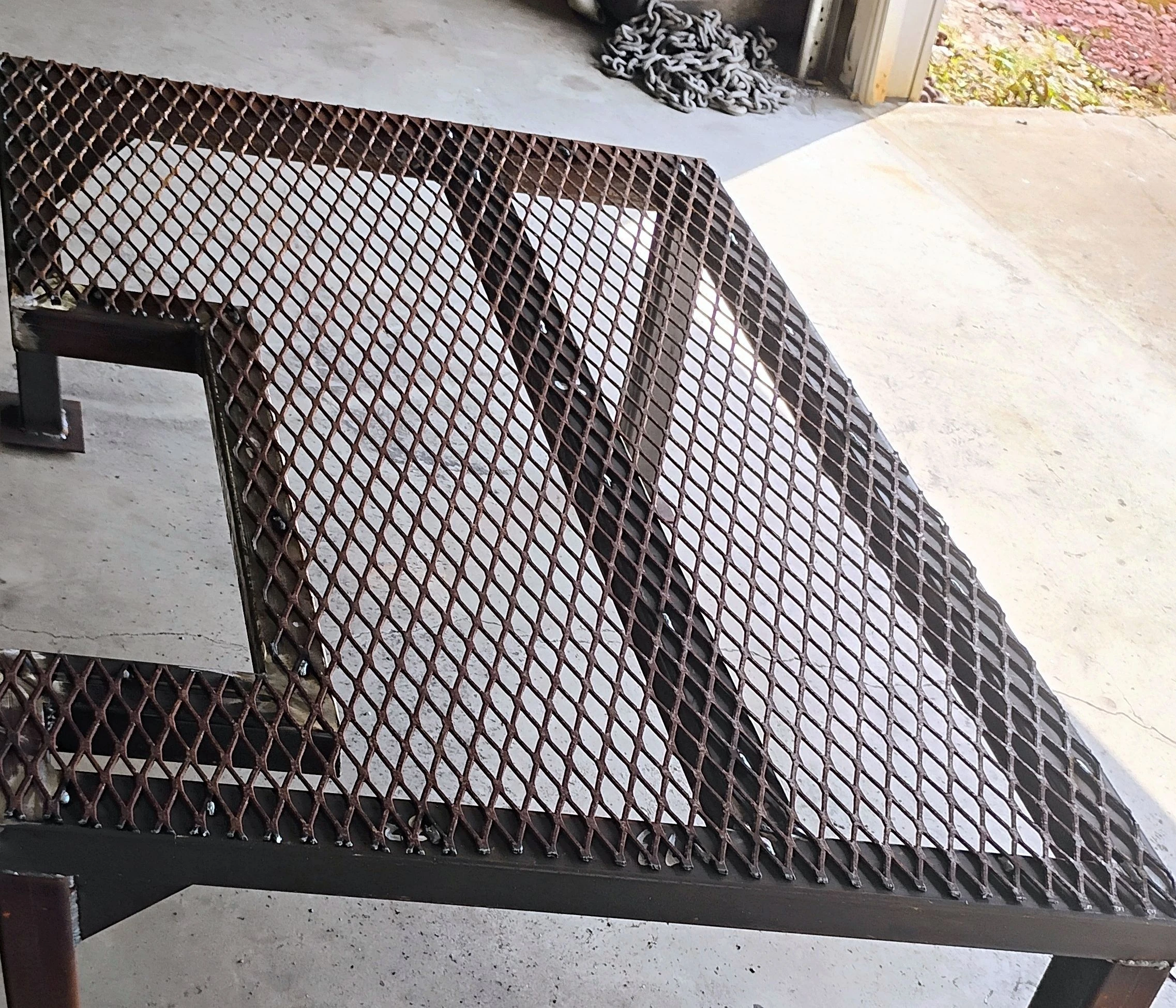 Expanded metal fence panel fabrication