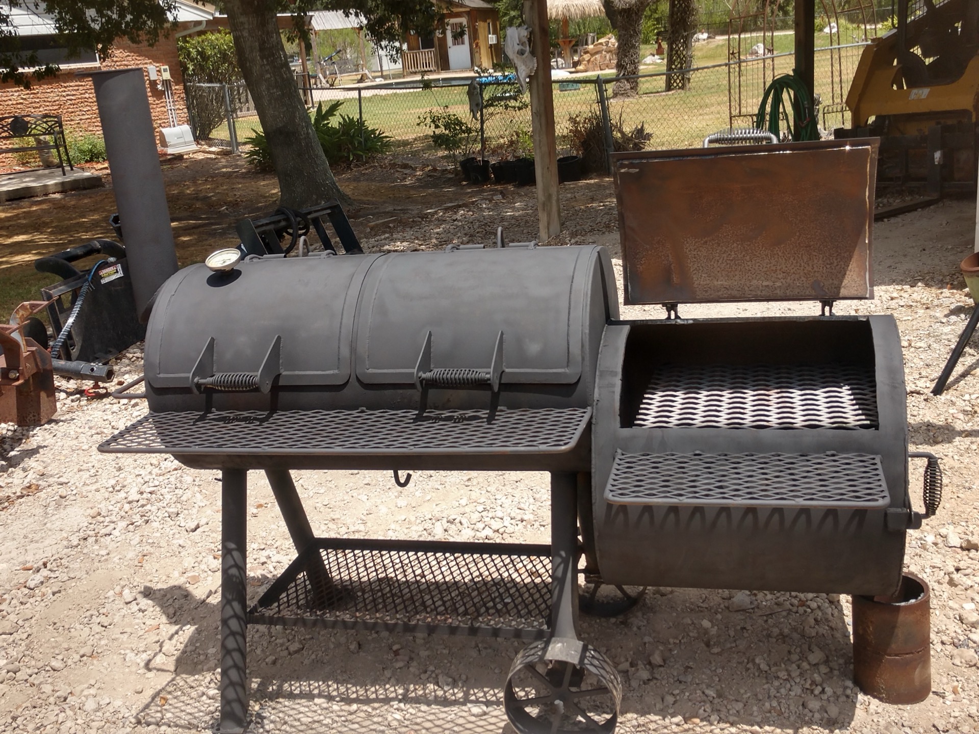 Offset smoker with firebox open
