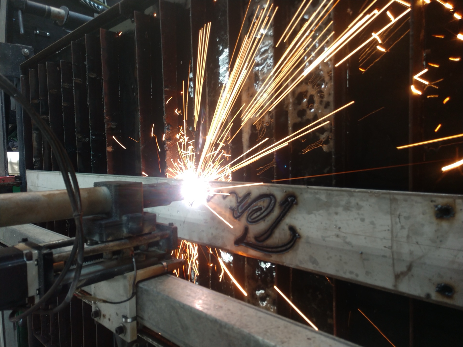 CNC plasma cutting with sparks flying